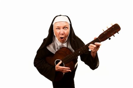Portrait of eccentric singing nun with evil expression on her face Stock Photo - Budget Royalty-Free & Subscription, Code: 400-04670493
