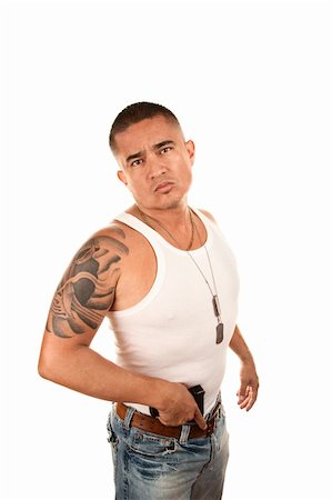 simsearch:400-04670594,k - Hispanic man with gun tucked in his belt Foto de stock - Super Valor sin royalties y Suscripción, Código: 400-04670546