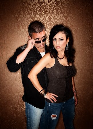 simsearch:400-04670594,k - Attractive Hispanic Couple Posing in Front of Gold Background Foto de stock - Super Valor sin royalties y Suscripción, Código: 400-04670580