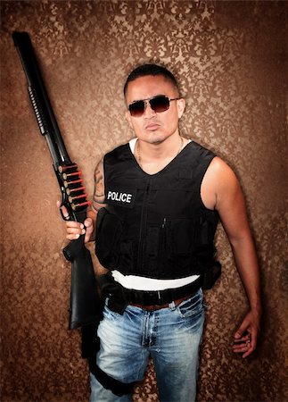 simsearch:400-04173797,k - Hispanic Cop Wearing Bulletproof Vest and Holding Shotgun Stock Photo - Budget Royalty-Free & Subscription, Code: 400-04670592