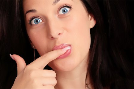 simsearch:400-04083912,k - Portrait of a beautiful caucasian young woman with beautiful blue eyes and finger in her mouth Stock Photo - Budget Royalty-Free & Subscription, Code: 400-04671098