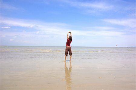 asian girl performing yoga on a beach Stock Photo - Budget Royalty-Free & Subscription, Code: 400-04671824