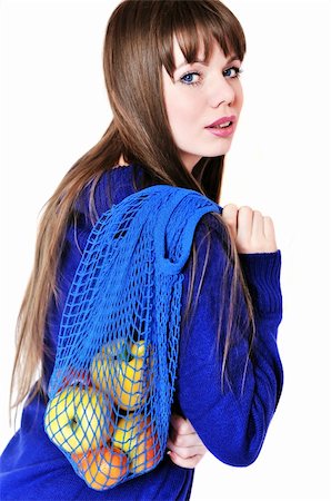 reana (artist) - longhaired girl wearing blue sweater with fruit and vegatables after shopping in greengrocery with  string bag Photographie de stock - Aubaine LD & Abonnement, Code: 400-04671865