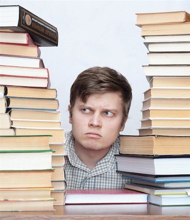 Young crazy discontent student between books Photographie de stock - Aubaine LD & Abonnement, Code: 400-04672134