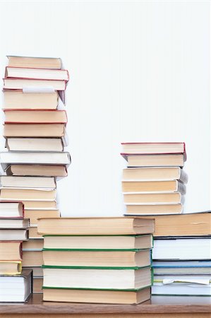 A pile of old books on a table light background Stock Photo - Budget Royalty-Free & Subscription, Code: 400-04672148
