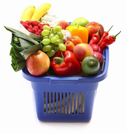 simsearch:400-03914983,k - A shopping basket full of fresh produce on white. Photographie de stock - Aubaine LD & Abonnement, Code: 400-04672347