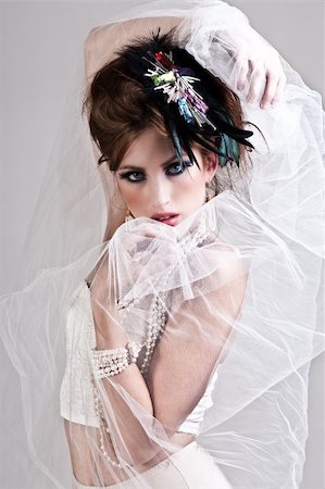 simsearch:400-04672924,k - Attractive young woman wearing underwear and a lace veil with her arms raised. Vertical shot. Photographie de stock - Aubaine LD & Abonnement, Code: 400-04672922