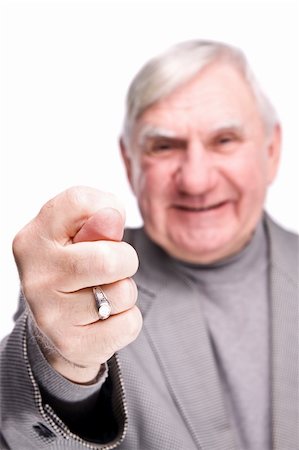 senior man showing fig on a isolated white background Photographie de stock - Aubaine LD & Abonnement, Code: 400-04672995