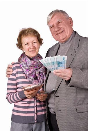 Elderly married couple with money in hands. Isolated on a White Background Photographie de stock - Aubaine LD & Abonnement, Code: 400-04672999