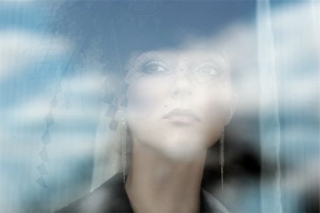dreaming cloud girl - The woman looks through a window Stock Photo - Budget Royalty-Free & Subscription, Code: 400-04673120