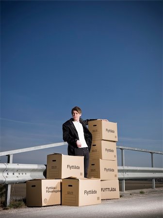 Man with Moving Boxes outdoor Stock Photo - Budget Royalty-Free & Subscription, Code: 400-04684560