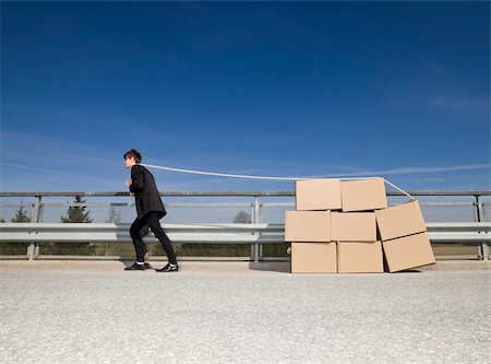 Man with Moving Boxes outdoor Stock Photo - Budget Royalty-Free & Subscription, Code: 400-04684561