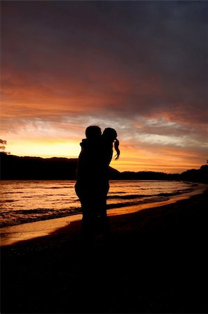 simsearch:400-06360128,k - A Couple kiss and hung in romantic sunset Stock Photo - Budget Royalty-Free & Subscription, Code: 400-04685110
