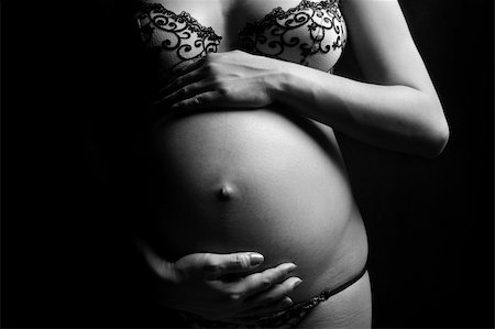 pregnant black mother - Belly contains a nine month old unborn child Stock Photo - Budget Royalty-Free & Subscription, Code: 400-04685267