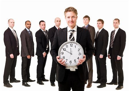 Business Manager with a clock in front of his team Stock Photo - Budget Royalty-Free & Subscription, Code: 400-04685557