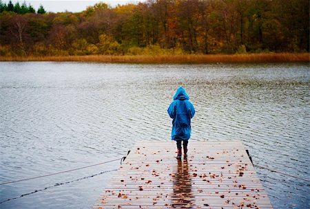 raincoat hood - A person is standing on a bridge by the lake Stock Photo - Budget Royalty-Free & Subscription, Code: 400-04685597