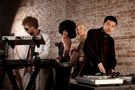 Cool performers at a disco party with admiring ladies Stock Photo - Budget Royalty-Free & Subscription, Code: 400-04686050