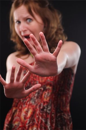 simsearch:400-04524241,k - Woman gesturing stop sign. Focus on arm. Photographie de stock - Aubaine LD & Abonnement, Code: 400-04686725