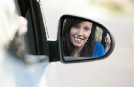 simsearch:400-05749371,k - Attractive teen girl sitting in her car holding keys after bying a new car Stock Photo - Budget Royalty-Free & Subscription, Code: 400-04686883