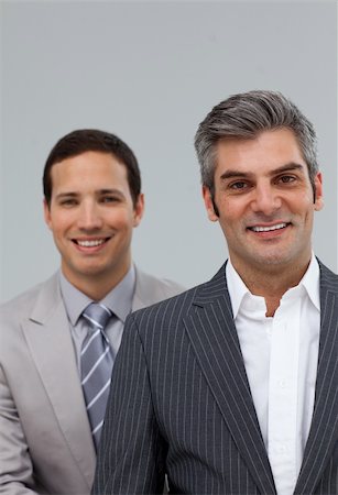 simsearch:400-05118165,k - Portrait of two businessmen smiling at the camera Foto de stock - Royalty-Free Super Valor e Assinatura, Número: 400-04687137