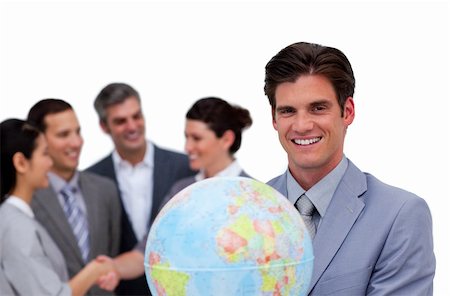 Happy businessman holding a globe in front of his team against a white background Stock Photo - Budget Royalty-Free & Subscription, Code: 400-04687132