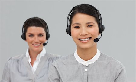 simsearch:400-03912315,k - Two attractive businesswomen with headset on in a row Photographie de stock - Aubaine LD & Abonnement, Code: 400-04687164