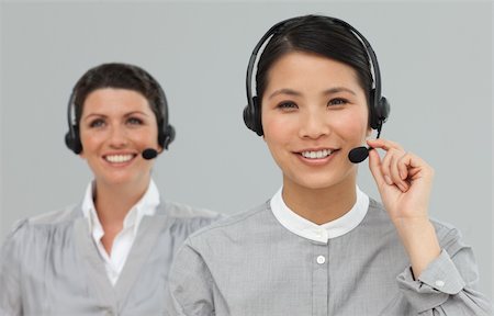 simsearch:400-03912315,k - Female Customer service agents with headset on looking at the camera Photographie de stock - Aubaine LD & Abonnement, Code: 400-04687166