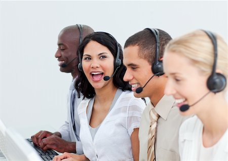 simsearch:400-04188205,k - Attractive young woman working in a call center with his colleagues Stock Photo - Budget Royalty-Free & Subscription, Code: 400-04687212