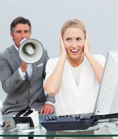 simsearch:400-04126489,k - Charismatic manager yelling through a megaphone in his colleague's ears in the office Stock Photo - Budget Royalty-Free & Subscription, Code: 400-04687310