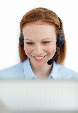 simsearch:400-03912315,k - Attractive businesswoman with headset on at work Photographie de stock - Aubaine LD & Abonnement, Code: 400-04687340