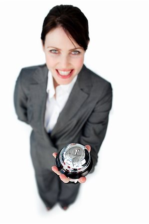 Charming caucasian businesswoman showing a service bell against a white background Stock Photo - Budget Royalty-Free & Subscription, Code: 400-04687357