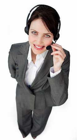 simsearch:400-03912315,k - Self-assured businesswoman talking on a headset against a white background Photographie de stock - Aubaine LD & Abonnement, Code: 400-04687353