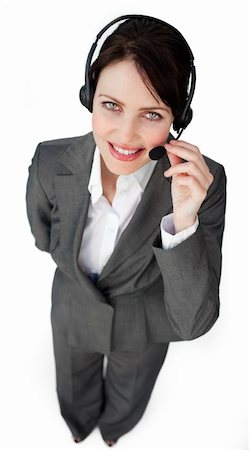 simsearch:400-04801703,k - Self-assured businesswoman talking on a headset against a white background Foto de stock - Super Valor sin royalties y Suscripción, Código: 400-04687353