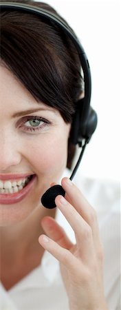 simsearch:400-03912315,k - Attractive customer service agent with headset on isolated on a white background Photographie de stock - Aubaine LD & Abonnement, Code: 400-04687364