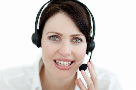 simsearch:400-04801703,k - Close-up of an attractive businesswoman with headset on against a white background Foto de stock - Super Valor sin royalties y Suscripción, Código: 400-04687362