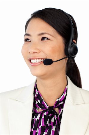 simsearch:400-04119293,k - Young Asian customer service representative using headset isolated on a white background Fotografie stock - Microstock e Abbonamento, Codice: 400-04688168