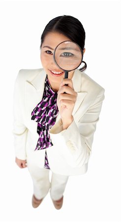 simsearch:400-04554899,k - Young Asian businesswoman looking through a magnifying glass isolated on a white background Stock Photo - Budget Royalty-Free & Subscription, Code: 400-04688160