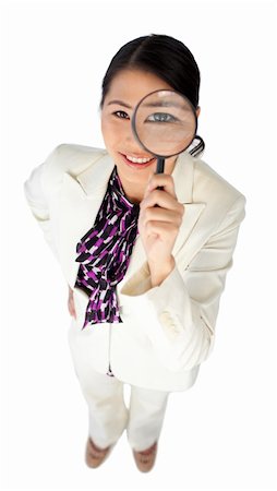 simsearch:400-04554899,k - Confident businesswoman holding a magnifying glass isolated on a white background Stock Photo - Budget Royalty-Free & Subscription, Code: 400-04688161