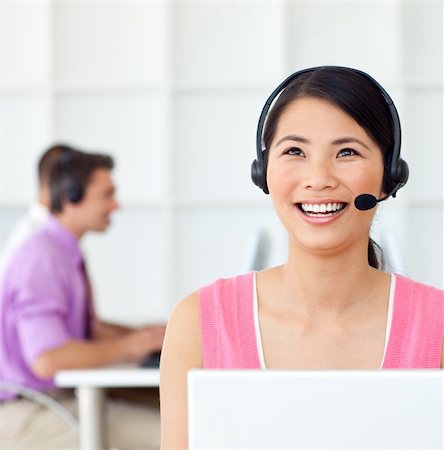 Laughing Customer service representative using headset in the office Stock Photo - Budget Royalty-Free & Subscription, Code: 400-04688179