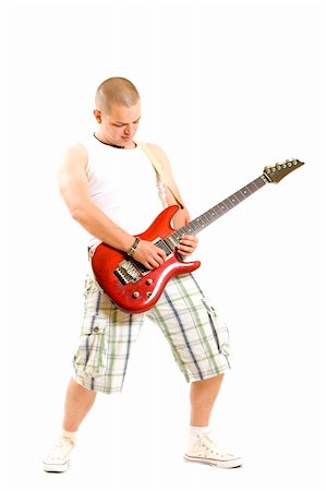 simsearch:673-02139028,k - Rock star with a guitar isolated over white background Fotografie stock - Microstock e Abbonamento, Codice: 400-04688247