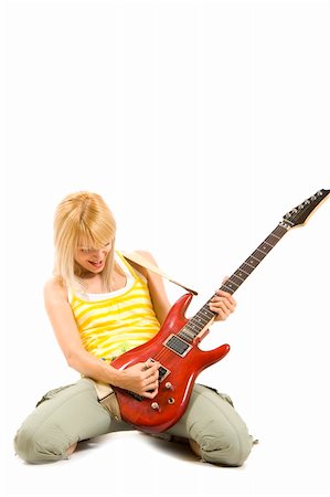 simsearch:400-04921650,k - passionate rock girl playing an electric guitar on her knees Stock Photo - Budget Royalty-Free & Subscription, Code: 400-04688249