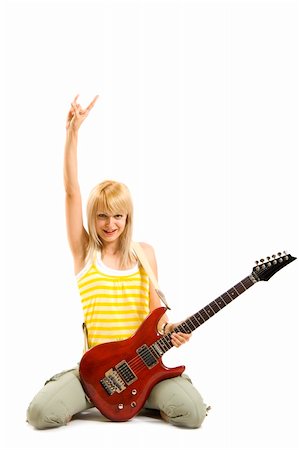 simsearch:400-04921650,k - passionate rock girl playing an electric guitar on her knees Stock Photo - Budget Royalty-Free & Subscription, Code: 400-04688250