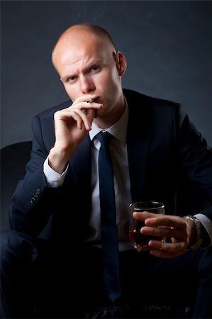 feedough (artist) - blue eyed businessman siting on a sofa and smoking a cigarette and drinking whiskey Photographie de stock - Aubaine LD & Abonnement, Code: 400-04688288