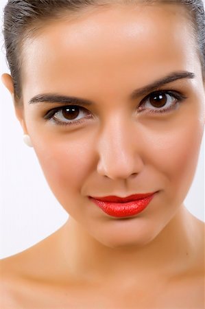 simsearch:400-04287911,k - Beautiful young woman face. Close up. over white Photographie de stock - Aubaine LD & Abonnement, Code: 400-04688292