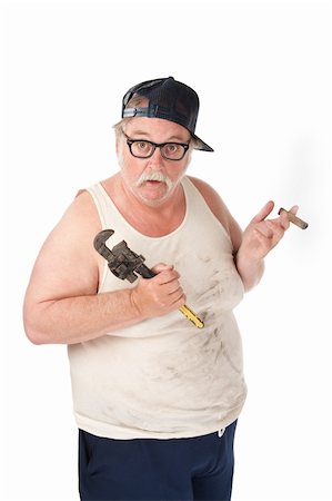 Fat man with a cigar who is confused about tools Stock Photo - Budget Royalty-Free & Subscription, Code: 400-04688520