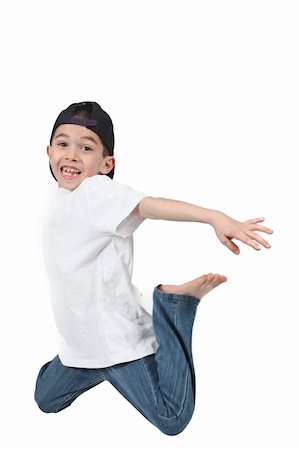 simsearch:400-06139772,k - Little boy jumping on isolated white background Photographie de stock - Aubaine LD & Abonnement, Code: 400-04688557