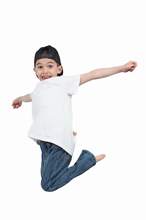 simsearch:400-04850794,k - Little boy jumping on isolated white background Stock Photo - Budget Royalty-Free & Subscription, Code: 400-04688561