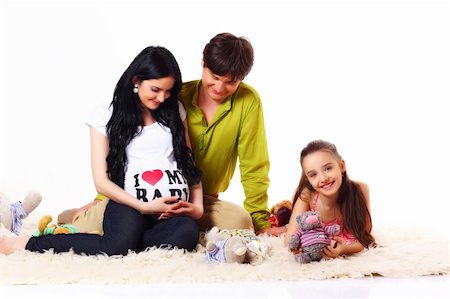 happy young couple with daughter expecting baby on white Fotografie stock - Microstock e Abbonamento, Codice: 400-04688818