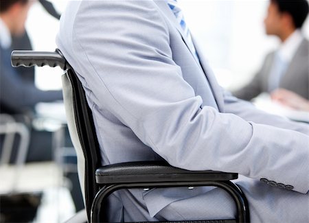 simsearch:400-05147195,k - Close-up of a businessman sitting on a wheelchair in a meeting Stock Photo - Budget Royalty-Free & Subscription, Code: 400-04689168