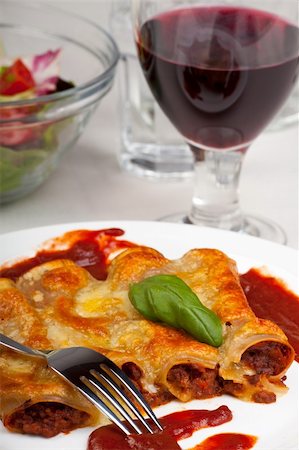 traditional cannelloni pasta dish with tomato sauce Stock Photo - Budget Royalty-Free & Subscription, Code: 400-04689708